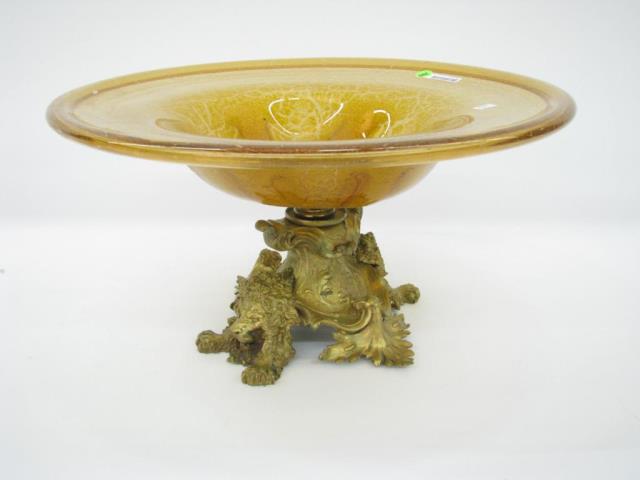 Appraisal: A French style console bowl with lion motif gilded spelter