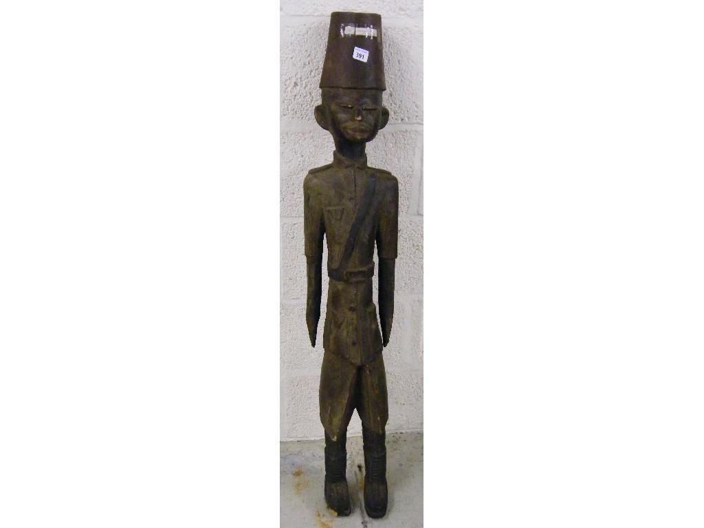 Appraisal: Kamba carving of a standing Colonial Askari soldier high