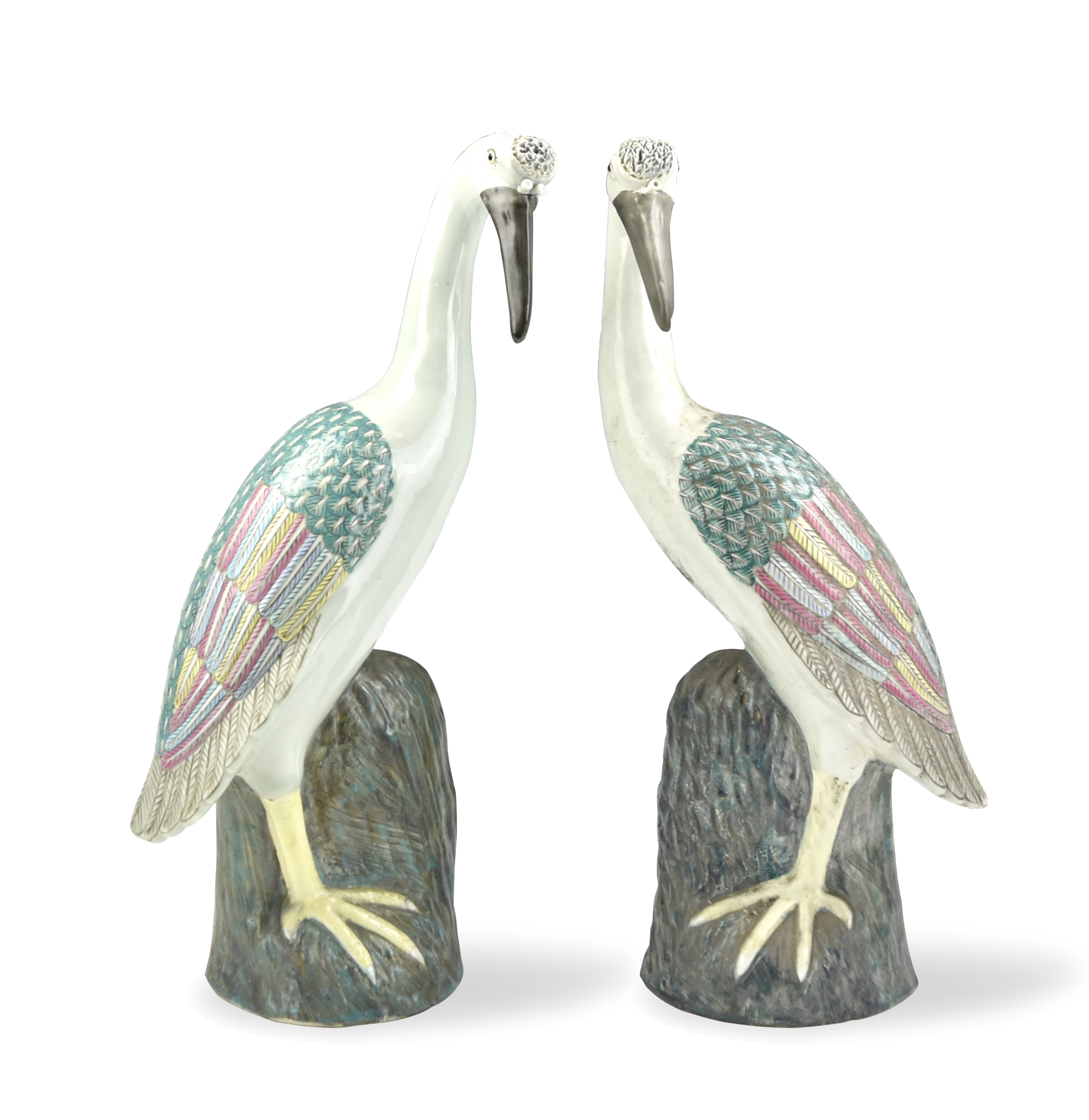 Appraisal: sculptured white cranes with long beaks perched on a brownish-green