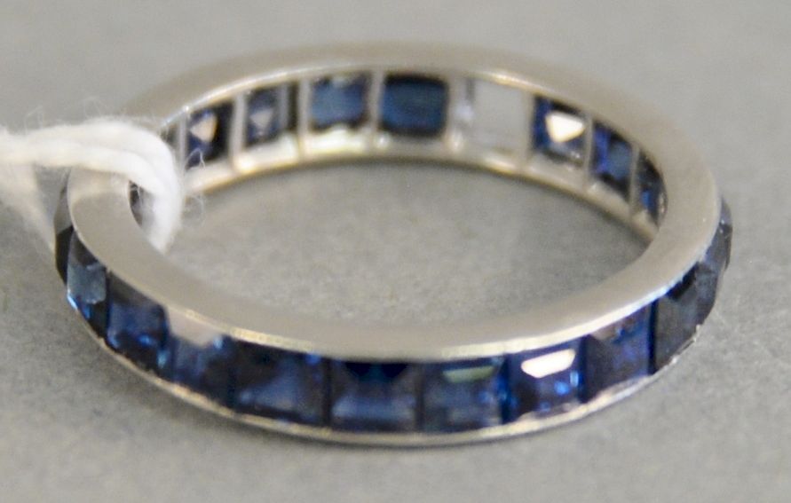 Appraisal: Platinum and sapphire ring with eternity band with channel set