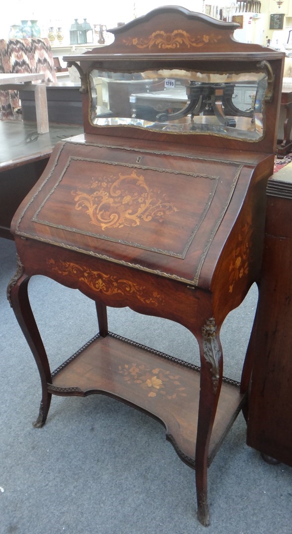 Appraisal: An early th century gilt metal mounted marquetry inlaid mahogany