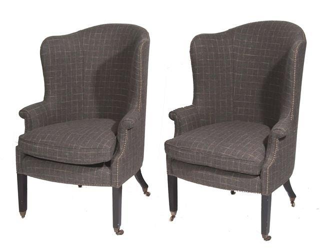 Appraisal: A PAIR OF GEORGIAN STYLE MAHOGANY WING ARMCHAIRS upholstered in