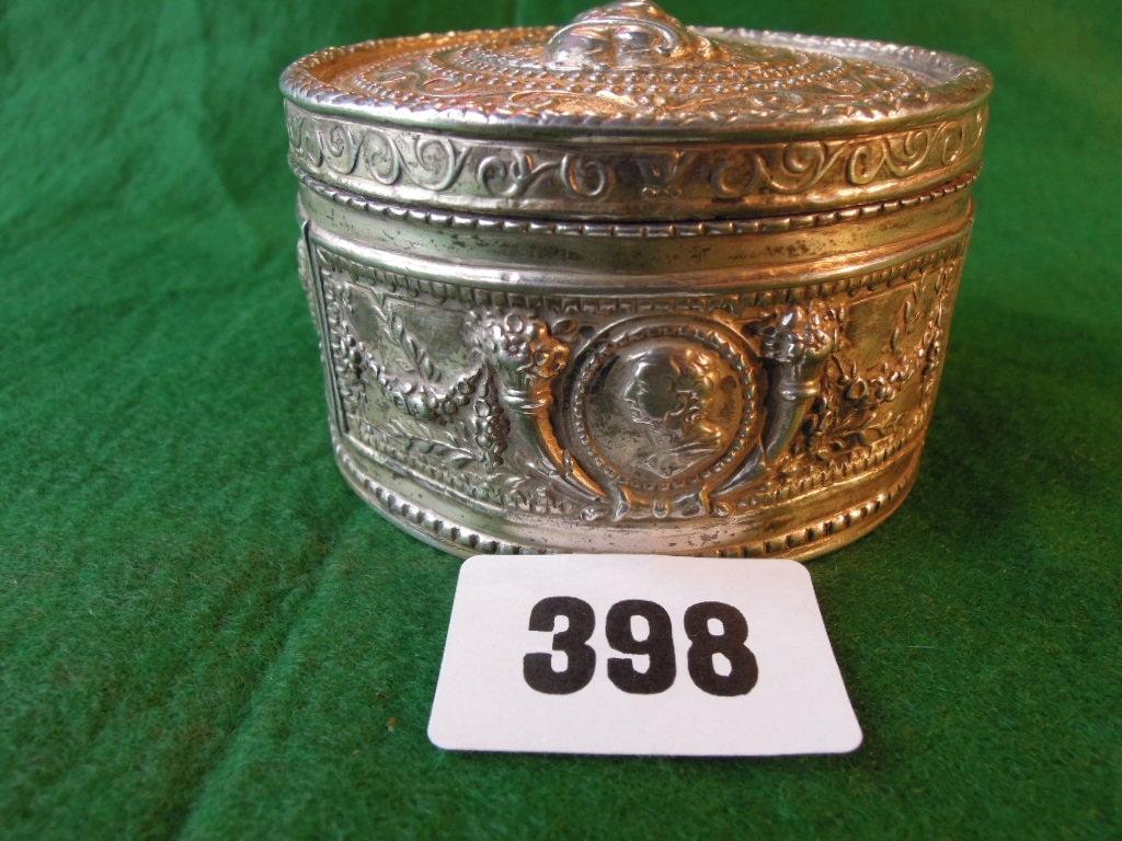 Appraisal: A circular silver trinket box with embossed bust of a