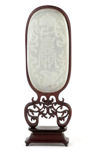 Appraisal: A Chinese carved jade plaque of oval form with hardwood