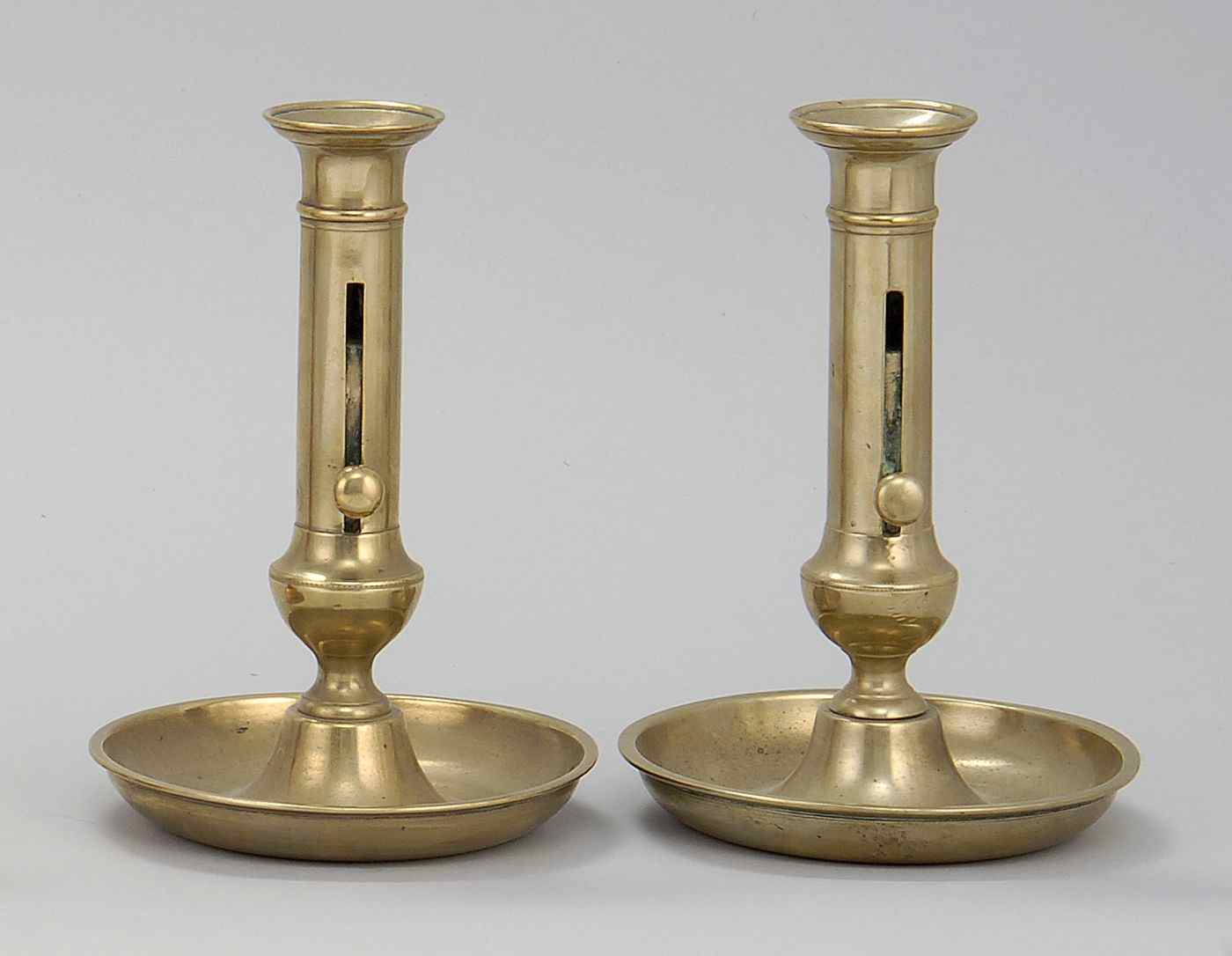 Appraisal: PAIR OF ANTIQUE BRASS SAUCER-BASE CANDLESTICKSProbably Dutch Late th Early