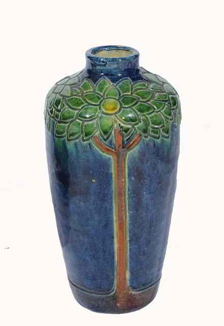 Appraisal: A French art pottery vase with raised stylised tree motifs