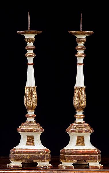 Appraisal: A pair of Italian polychromed and parcel giltwood pricket candlesticks