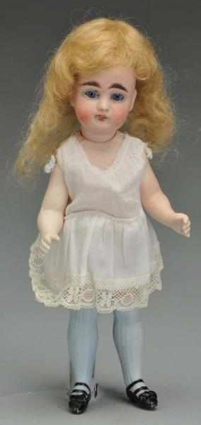 Appraisal: All Bisque Child Doll with Blue Stockings Description German bisque