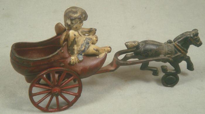 Appraisal: Cast iron toy horse drawn cart in shape of a