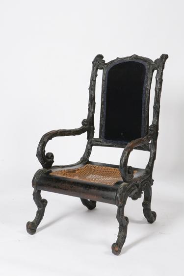 Appraisal: A VICTORIAN EBONISED BLACK FOREST ARMCHAIR the frame all over