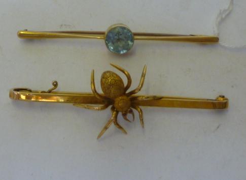 Appraisal: A GOLD SPIDER BROOCH modelled realistically and set with ruby