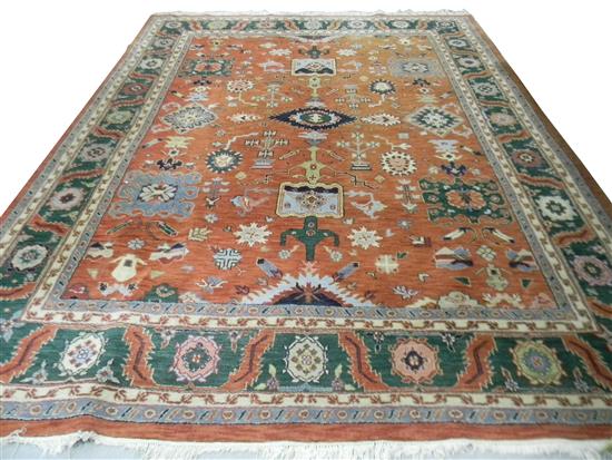 Appraisal: RUGS Modern Indo-Persian design salmon ground with hunter green border