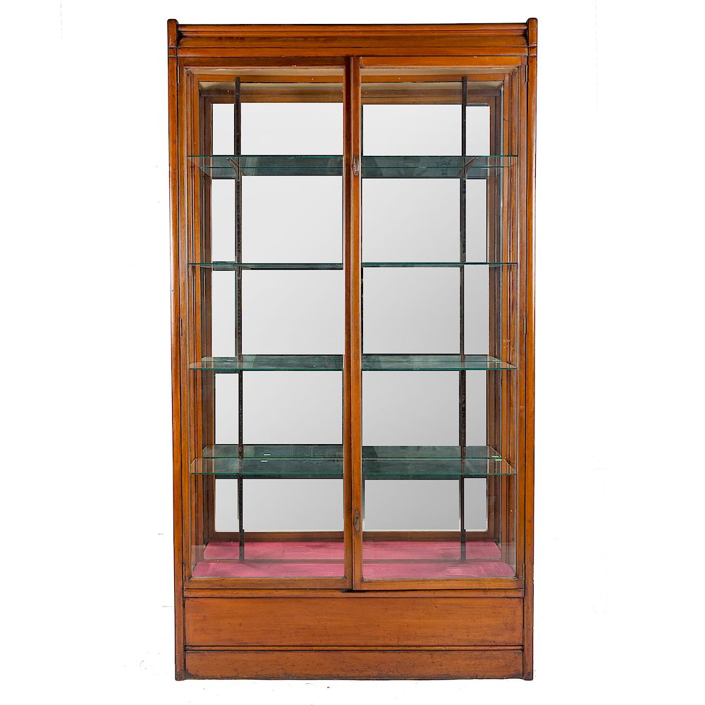 Appraisal: Edwardian walnut glass display case metal label POLLARDS Store Fitters