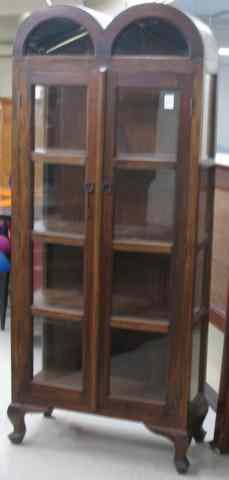 Appraisal: PLANTATION MAHOGANY DISPLAY CABINET featuring a long pair of glass-panel