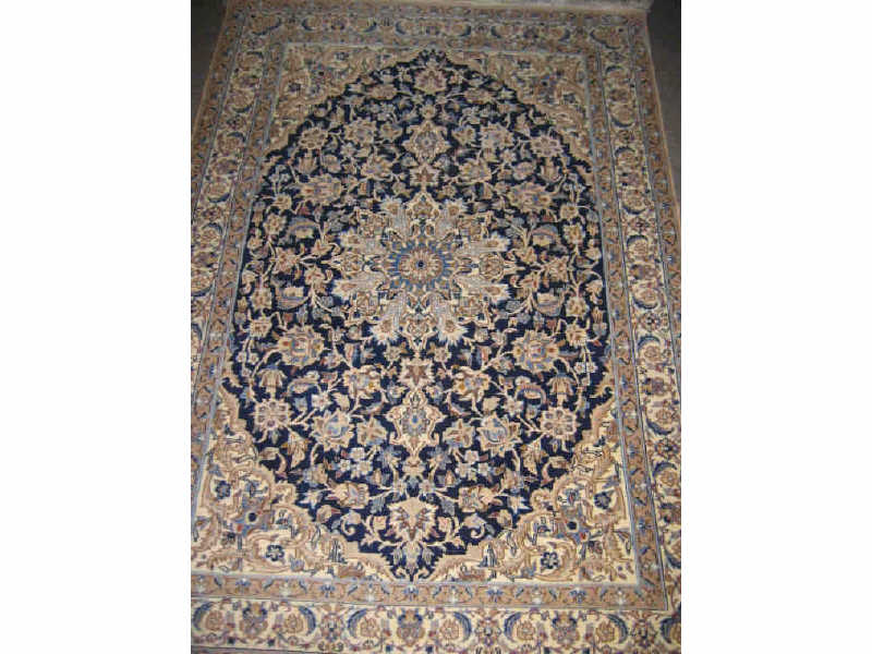 Appraisal: FINE NAIN THROW RUG The navy blue field of floral