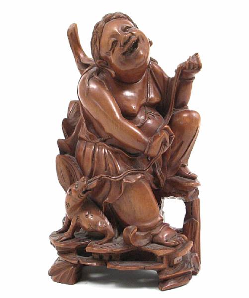 Appraisal: A Chinese wood carving of an immortal with toad height