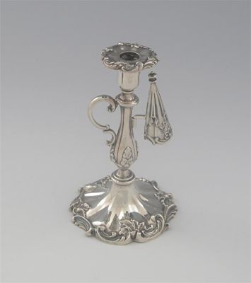 Appraisal: A Victorian decorative taperstick with a baluster stem scroll handle