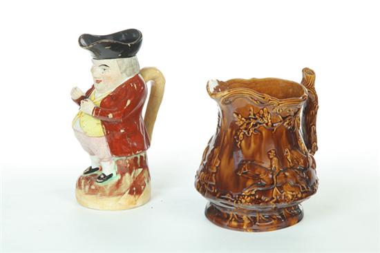 Appraisal: TWO PITCHERS Nineteenth century Staffordshire toby jug Wear ''h And