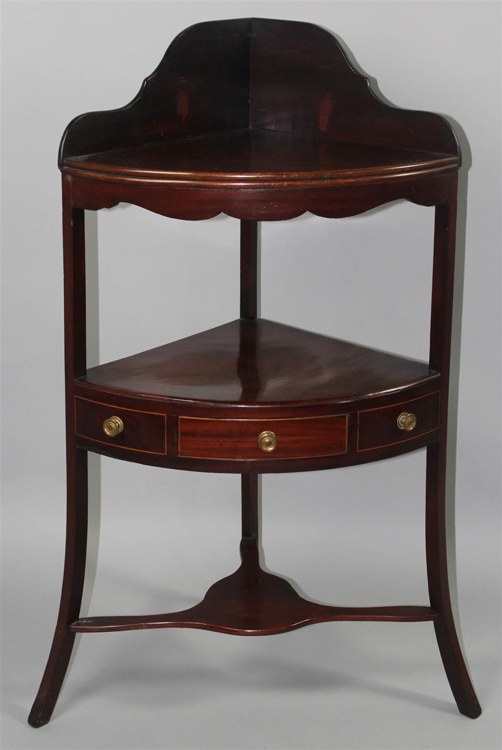 Appraisal: GEORGE III LINE INLAID MAHOGANY TRIPOD CORNER WASHSTAND fitted with