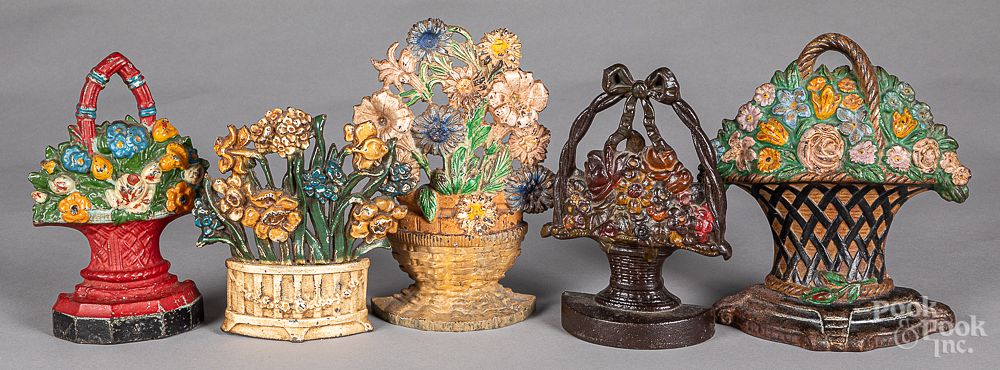 Appraisal: Five cast iron floral doorstops Five cast iron floral doorstops