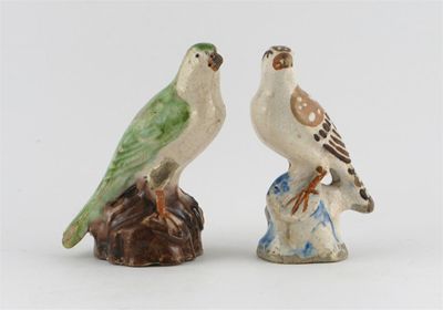 Appraisal: Two Chinese pottery models of birds perched on rocks one