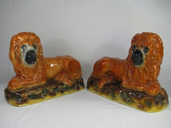 Appraisal: Pair of large ceramic Staffordshire style lions laying down with