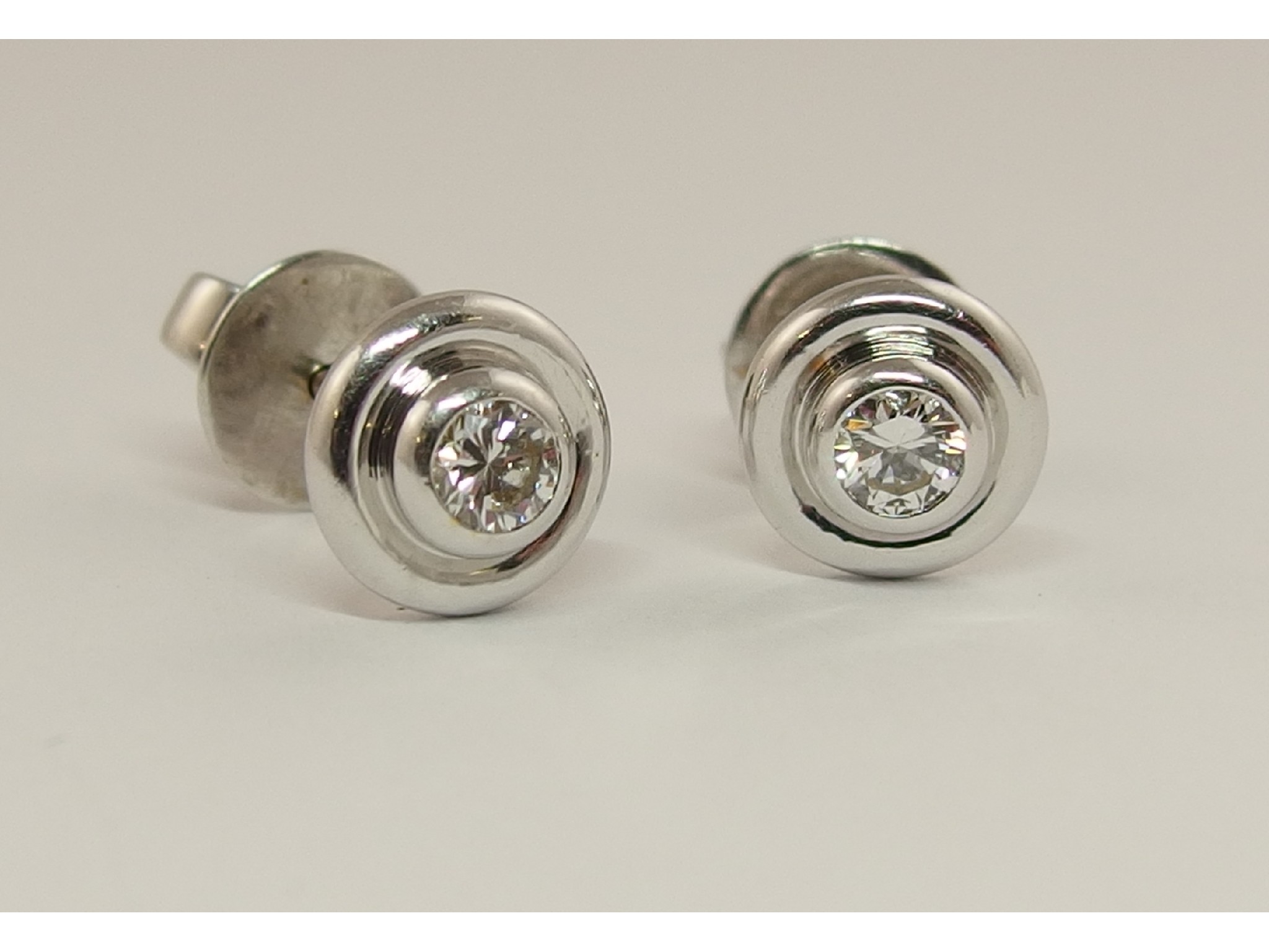 Appraisal: A pair of ct white gold diamond earstudsapproximate combined diamond