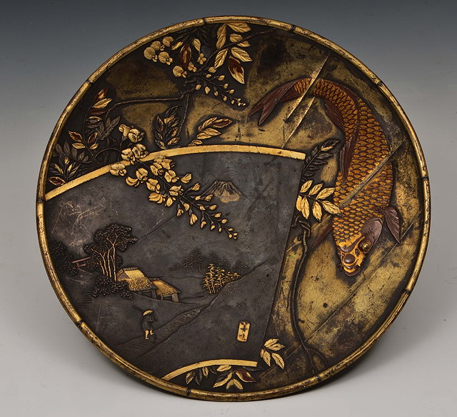 Appraisal: A Japanese bronze dishMeiji periodsigned with inlaid decoration showing a