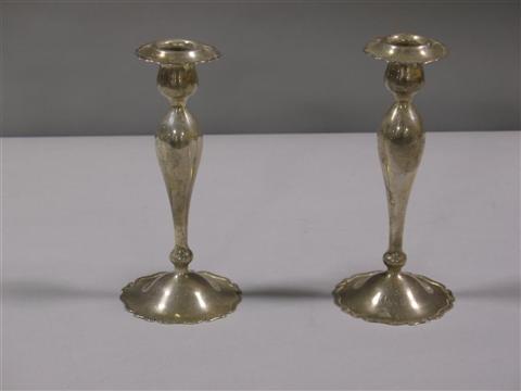 Appraisal: PAIR SHREVE TREAT EACRET SILVER CANDLESTICKS Of delicate shaped columnar