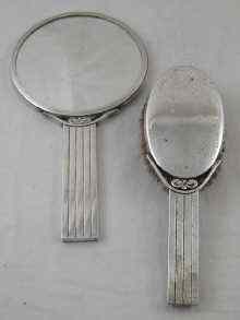 Appraisal: A silver plated mirror and brush of Art Deco Scandinavian