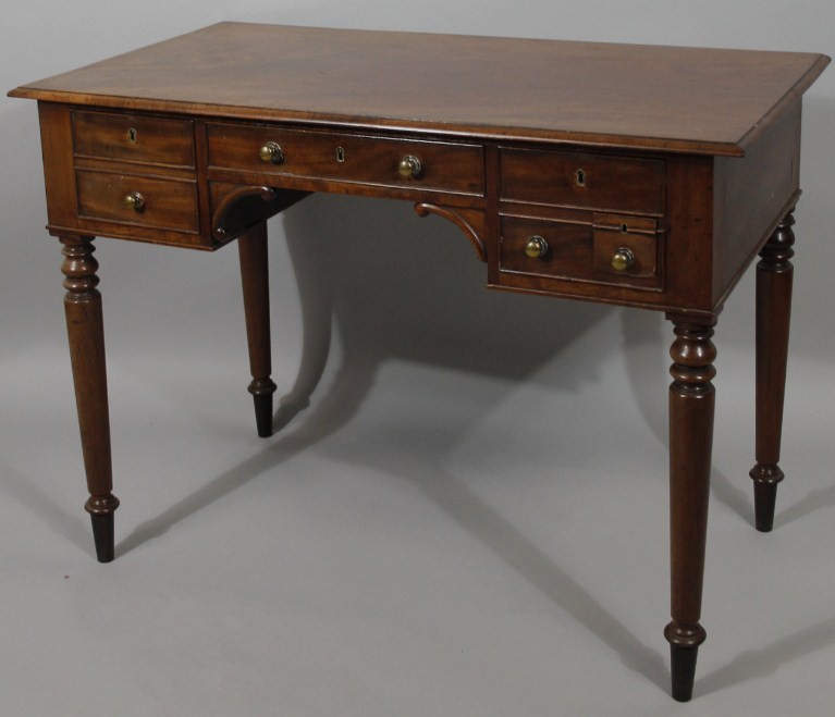 Appraisal: A thC mahogany dressing table with rectangular overhanging top raised