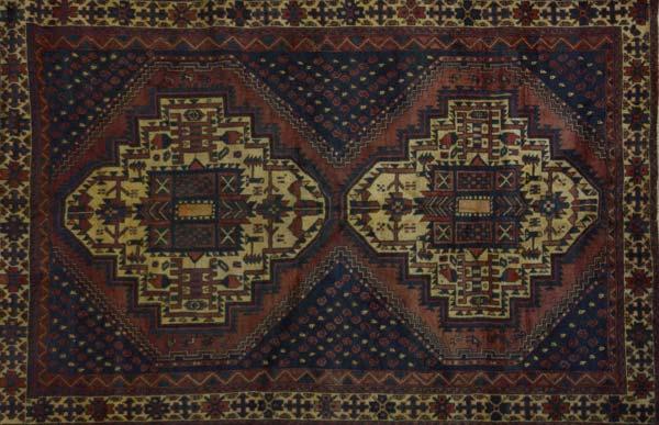 Appraisal: PERSIAN SHIRAZ Area rug with saffron geometric medallions on a