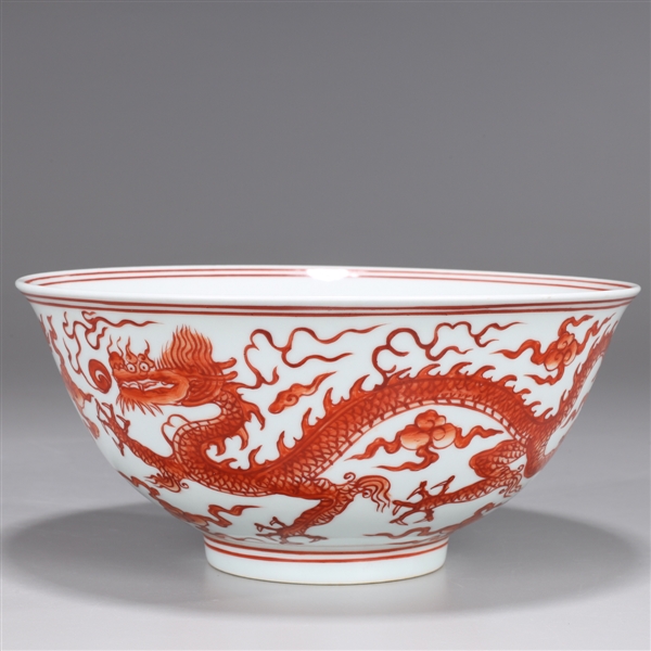 Appraisal: Chinese red and whtie porcealin bowl with dragon chasing flaming