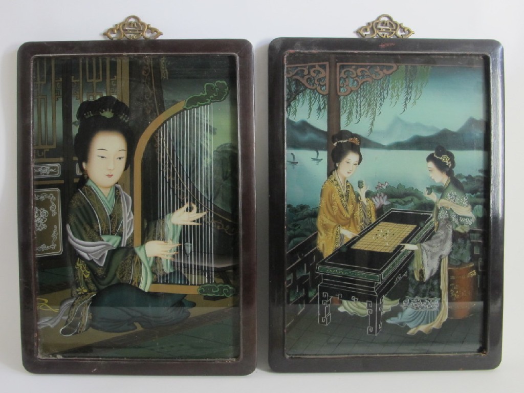 Appraisal: A pair of Chinese inside painted glass panels depicting a