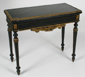 Appraisal: French turned leg lift top ebonized game table curved front