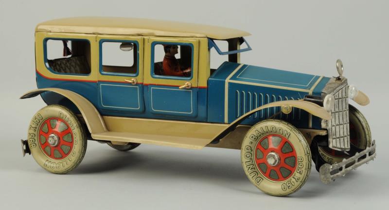 Appraisal: German Tin Litho Wind-Up Fisher Limousine Original tin lithographed driver