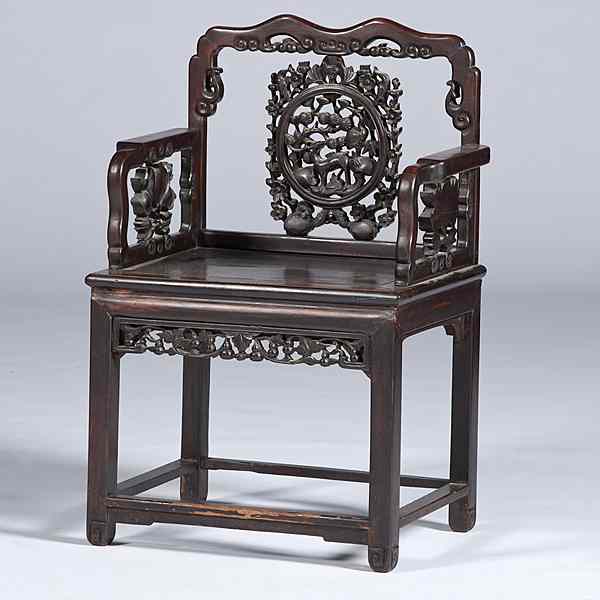 Appraisal: Chinese Hardwood Armchair Chinese A carved hardwood open armchair probably