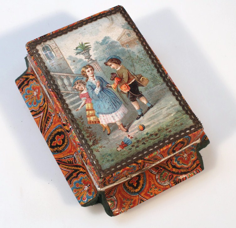 Appraisal: An Edwardian compressed card jewellery casket decorated with children to