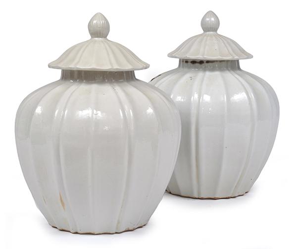 Appraisal: TWO CHINESE BLANC DE CHINE GLAZED EARTHENWARE JARS WITH COVERS