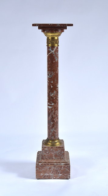 Appraisal: An Empire style marble columnwith square pedestal top and gilt