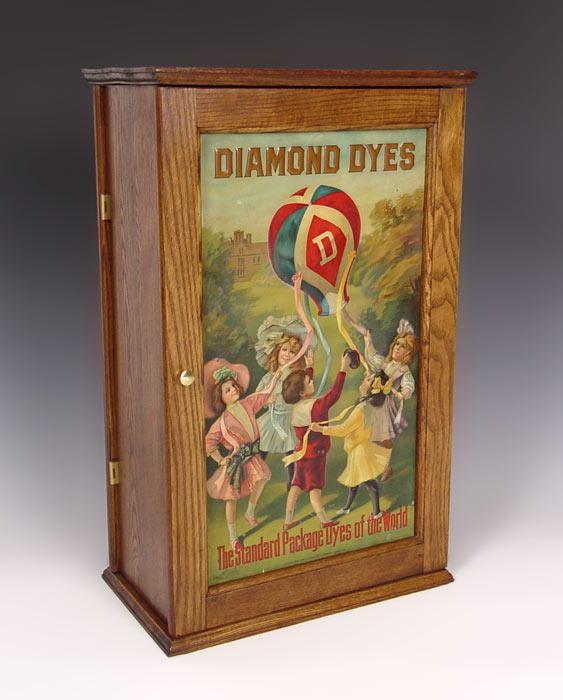 Appraisal: DIAMOND DYES TIN LITHO STORE CABINET Children with balloon tin