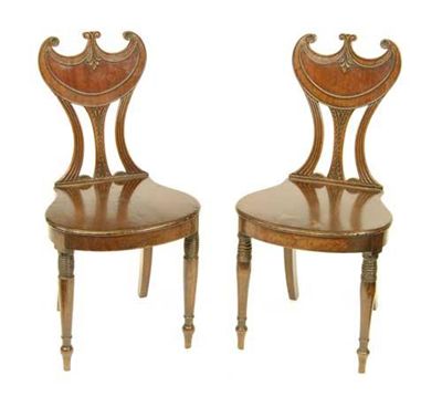 Appraisal: A pair of Regency mahogany hall chairs each with a