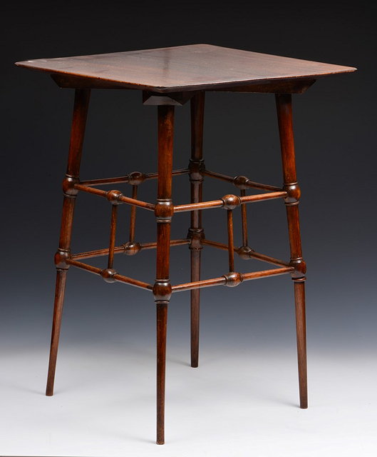 Appraisal: Manner of E W Godwin British - Mahogany occasional table