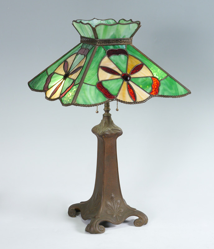 Appraisal: VINTAGE LEADED STAINED GLASS LAMP Patinated metal base with foliate