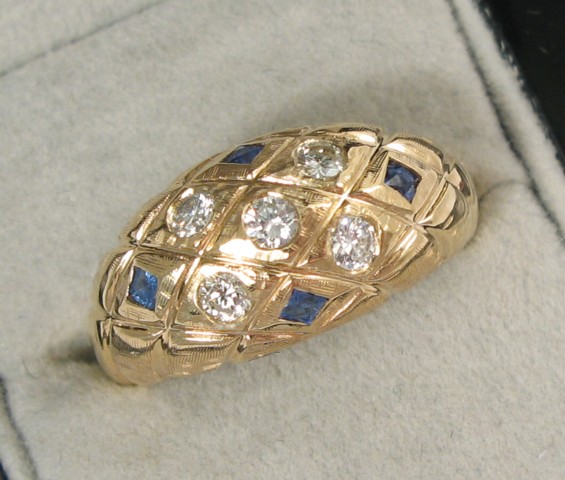 Appraisal: SAPPHIRE AND FOURTEEN KARAT GOLD RING set with four facet-cut