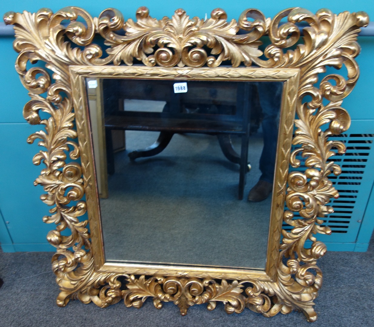 Appraisal: A rococo revival gilt framed mirror with extensive acanthus scroll