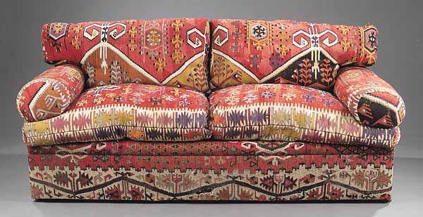 Appraisal: A Contemporary Sofa Upholstered in Antique Kilim the shaped back