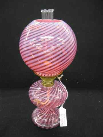 Appraisal: Victorian Cranberry Opalescent Glass MiniatureOil Lamp swirl design acorn burner