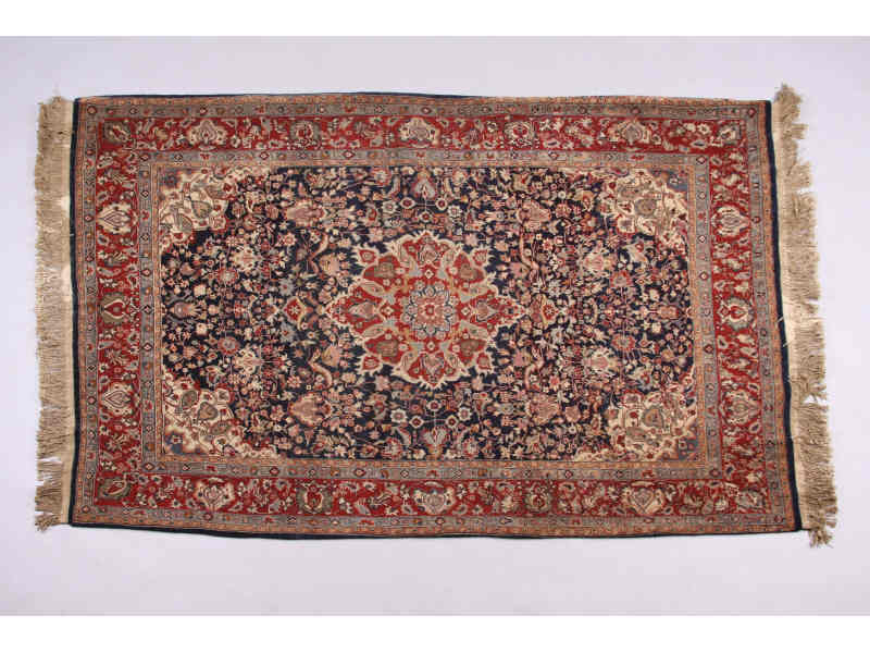 Appraisal: Persian Area Rug th c central brick medallion on blue