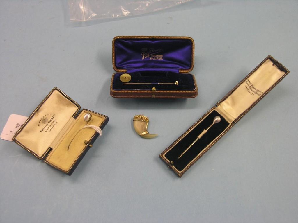 Appraisal: A ct gold tie-pin set cased incomplete two other tie-pins